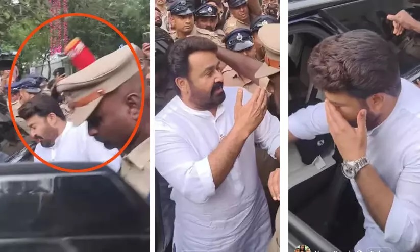 Actor Mohanlal consoles a journalist after he was hit in the eye by a TV channel's microphone.