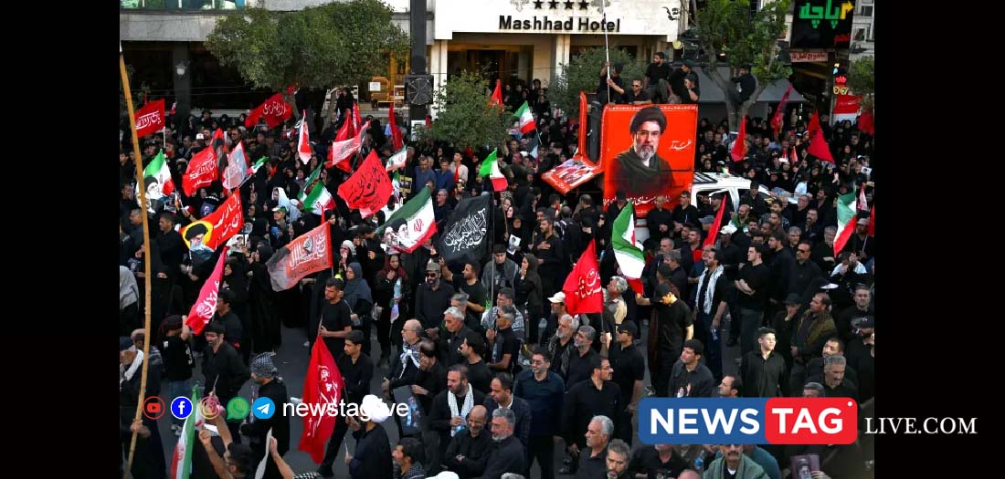 Crowds gather around a portrait of Iran's Supreme Leader Mojtaba Khamenei