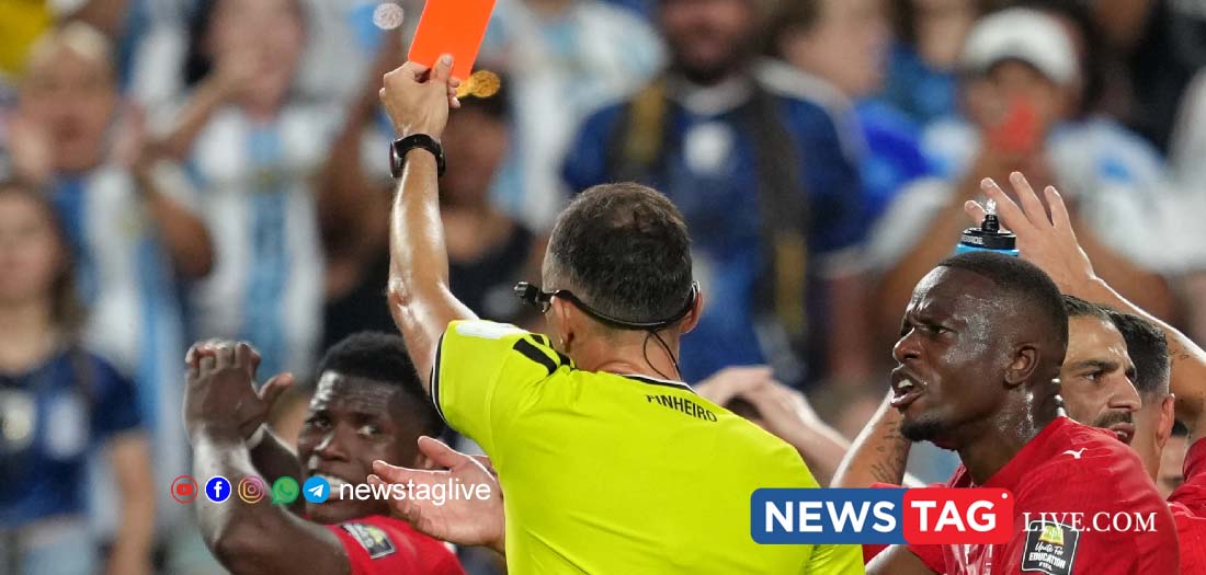 Referee Joao Pinheiro, gives a red card to Switzerland Breel Embolo